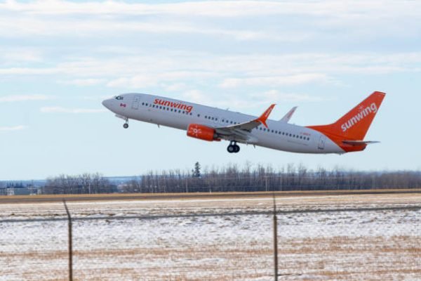 A Sunwing Airlines Boeing 737 NG Max, with identification C-CNGH, takes off from Edmonton International Airport on November 17, 2019