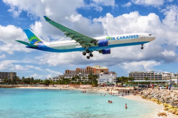 Sint Maarten – September 17, 2016: Air Caraibes Airbus A330-300 airplane at Sint Maarten airport (SXM) in Sint Maarten. Airbus is a European aircraft manufacturer based in Toulouse, France.