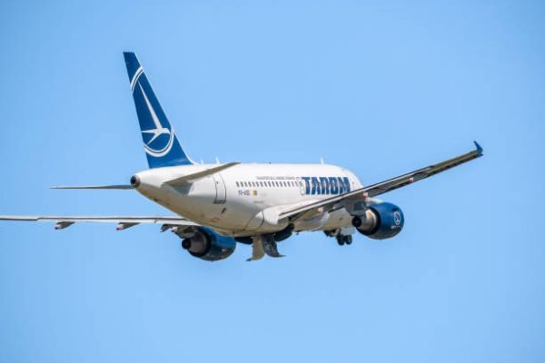 Bucharest, Romania - 05.14.2021: YR-ASD TAROM Airbus A318-111 airplane flying against clear blue sky. Airplane takes off from Henri Coanda International Airport.