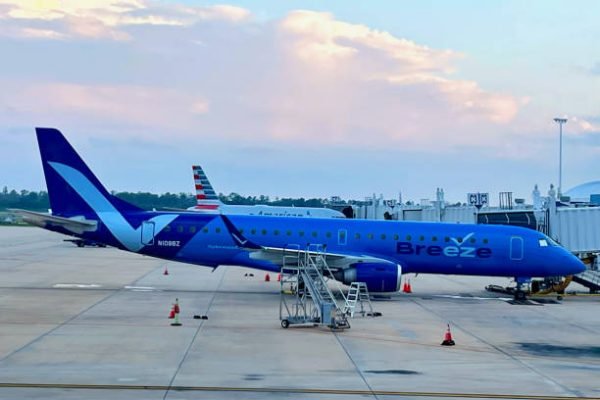 Jacksonville, Florida, USA - May 19, 2023: A Breeze Airways passenger jet at Jacksonville International Airport (JAX) at dusk.