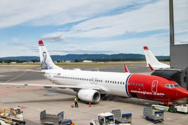 Oslo, Norway - 08.01.2024: Norwegian Air Shuttle airplane at Oslo Airport, Norway. SAS aircraft on runway in Oslo airport. Norwegian is a Norwegian low-cost airline