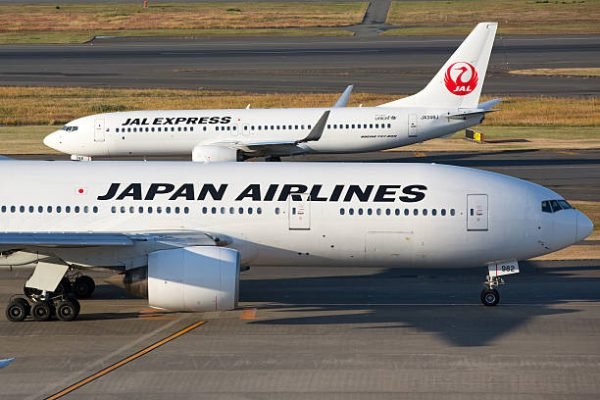 Tokyo, Japan - December 4, 2012: Japan Airlines airplane and JAL Express airplane at Tokyo International Airport (Haneda Airport) in Japan. It is located in Ota Ward, Tokyo, Japan. Tokyo International Airport is the busiest airport in Japan.