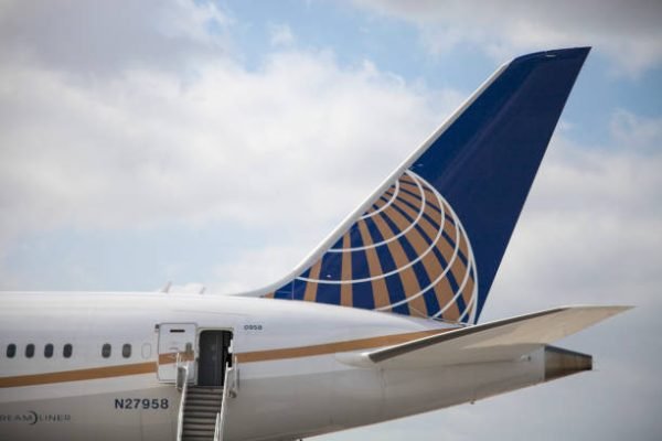 The tail end of a United Airlines 787 Dreamliner airplane at Los Angeles Airport.